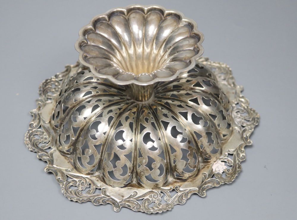 A pierced and embossed silver footed bowl, maker C.C, Chester 1907 and two silver sugar bowls, approx 13oz
